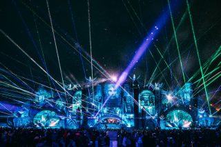 Crowds at Tomorrowland Winter festival in Alpe d’Huez with mountain backdrop