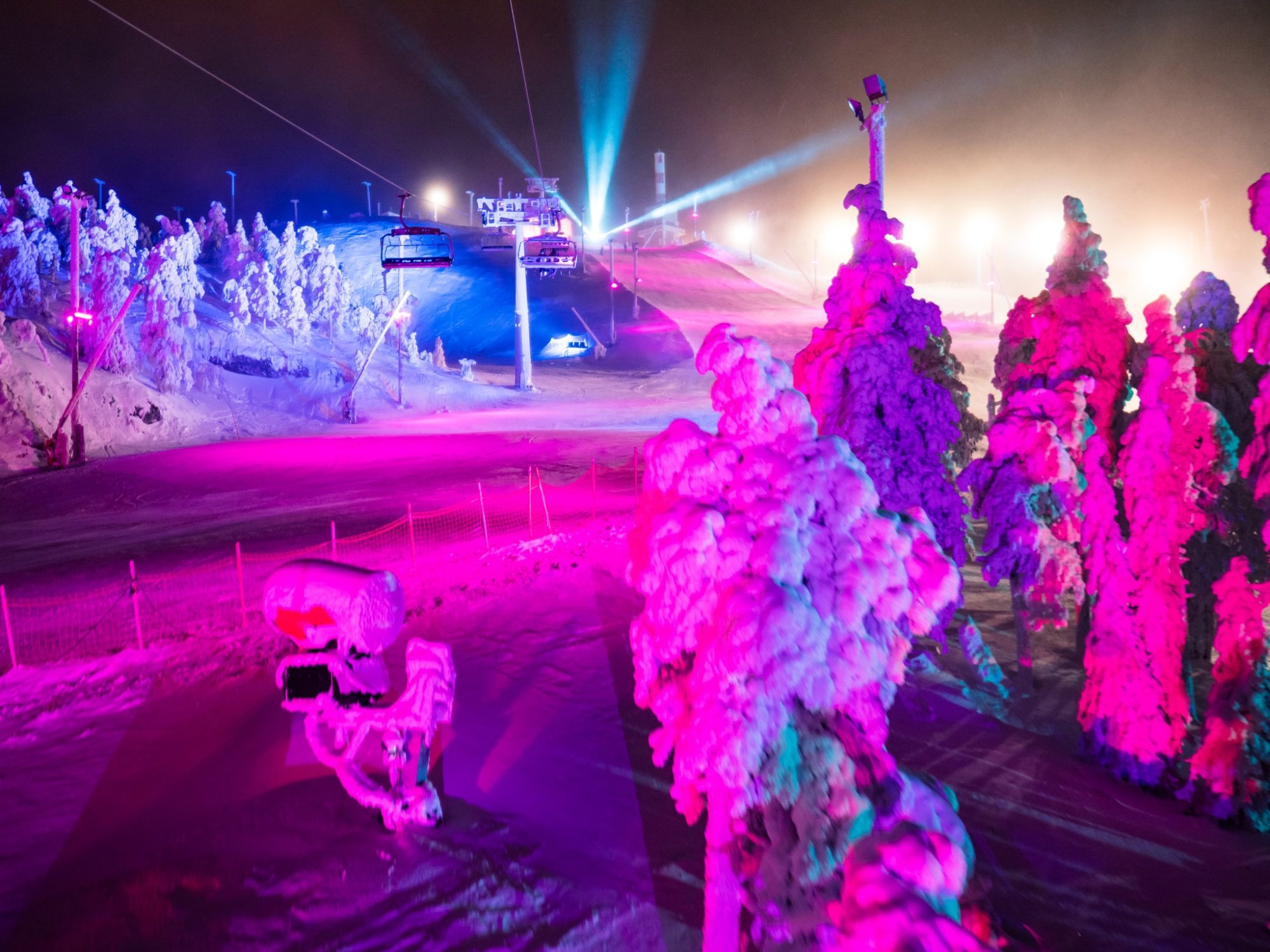 The MultiColoured Ski Slopes of the Polar Night Light Festival InTheSnow