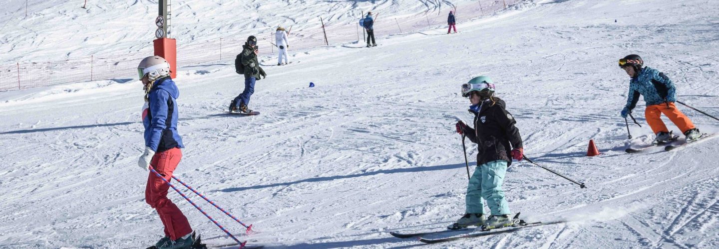 Skiers on the new speed education run in Arc 1800, Les Arcs, French Alps – winter safety training slope