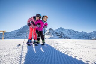 family skiing in Jungfrau